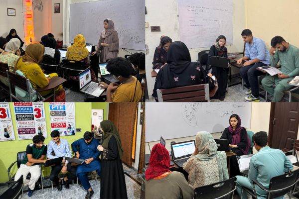 A mentor in a small group session working closely with students on their projects and career development