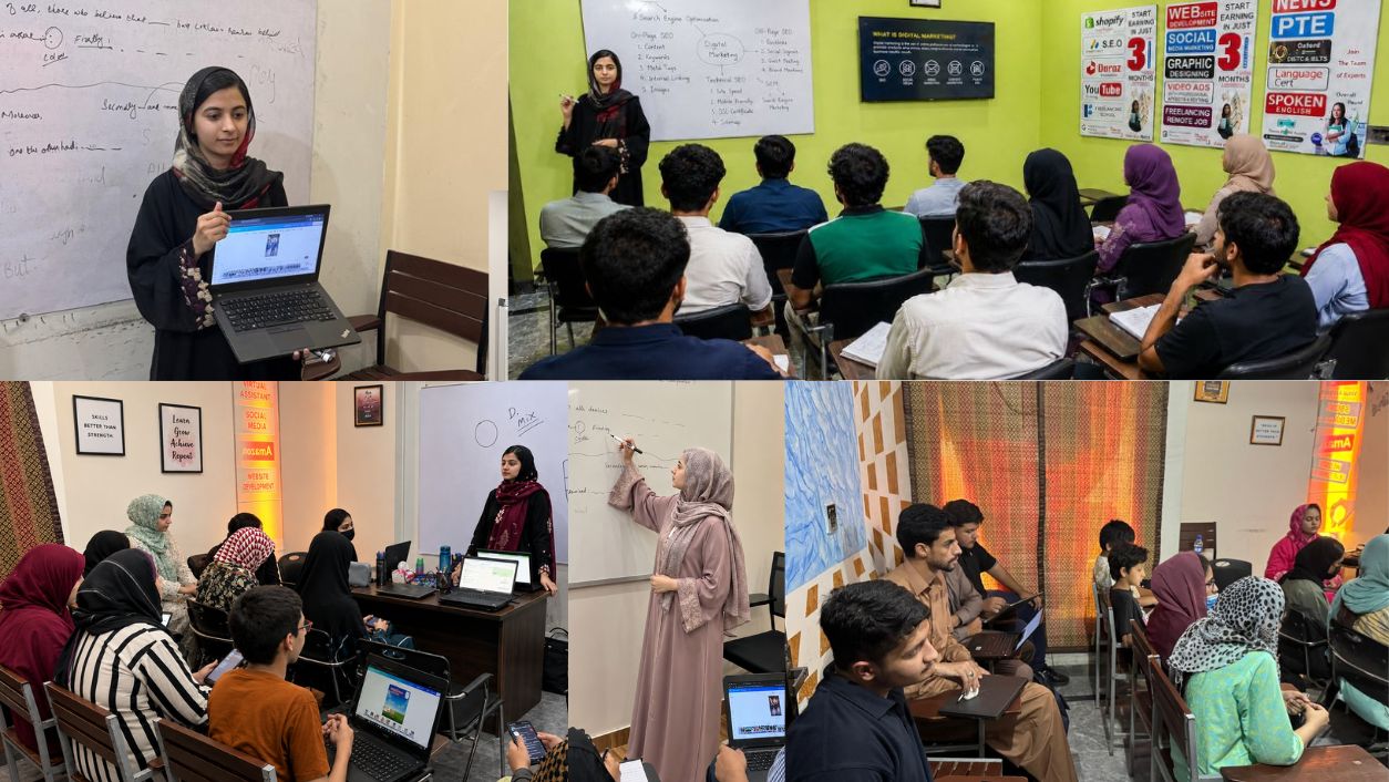 Students engaged in a practical classroom session with an instructor teaching at the front of the class